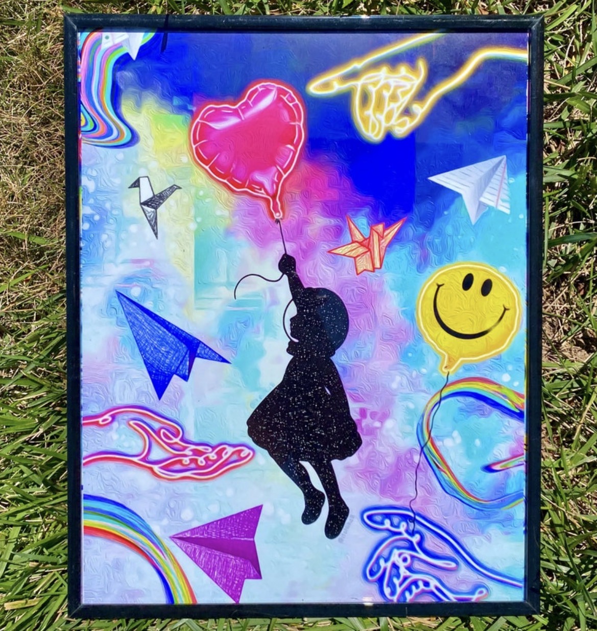 Framed art print with a floating silhouette, bright balloons, paper planes and neon hands
