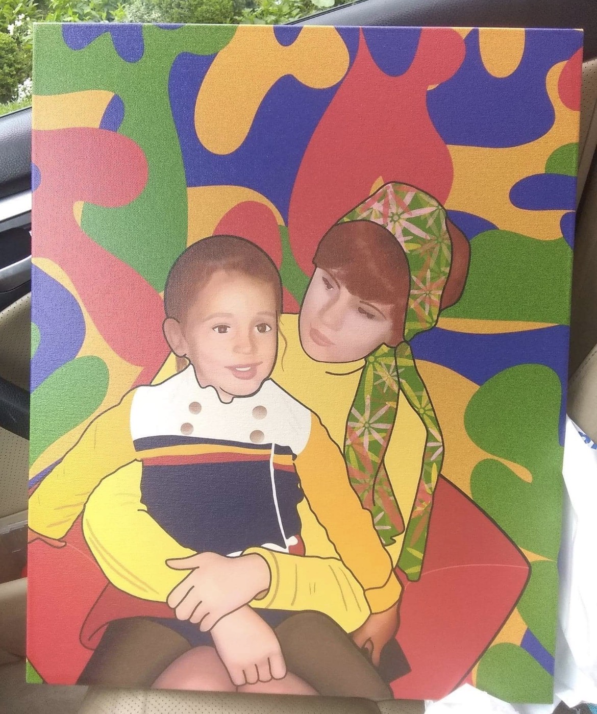 Painted portrait of a woman holding a child against a colorful abstract background