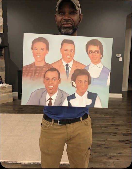 Customer holding a commissioned portrait of five family members by Nika B