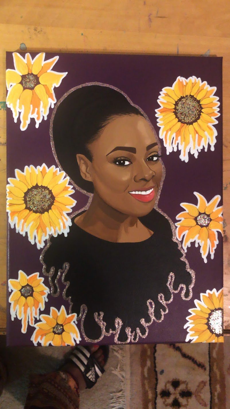 Commissioned portrait of a smiling woman surrounded by sunflowers