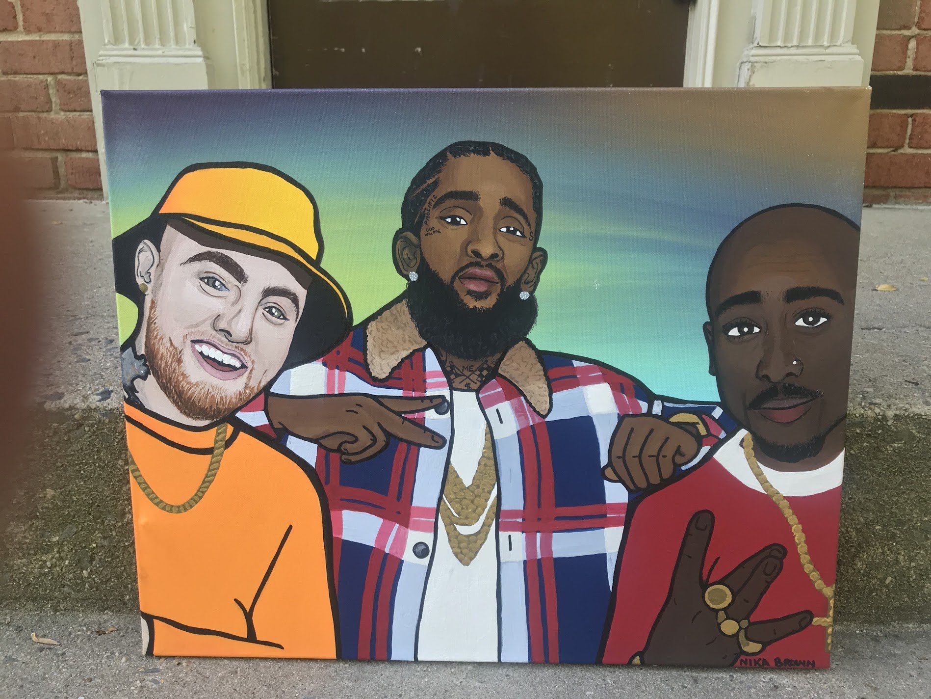 Colorful tribute painting of Mac Miller, Nipsey Hussle, and Tupac